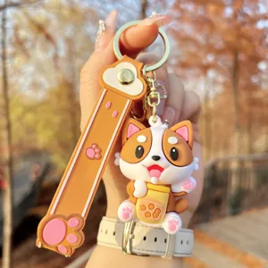 Close-up detail of the cute Corgi boba tea silicone keychain with lovely paw print strap.