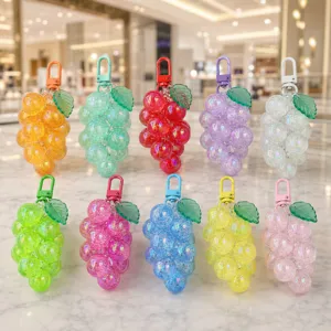 Colorful crystal grape acrylic keychain detail shot, showing sparkling fruit design and metal clasp.