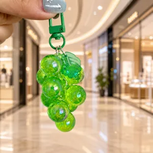 Transparent acrylic grape cluster keychain cute fruit bag pendant phone strap accessory.