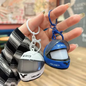 Mini motorcycle helmet keychain with glowing design, cute trendy car accessory bag pendant.