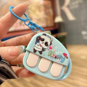 Cute cartoon panda piano recorder keychain toy, decompression bag pendant accessory details.