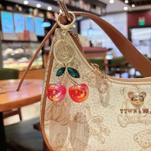 Chic luxury cherry keychain bag charm with colorful crystal fruit pendant for women fashion.