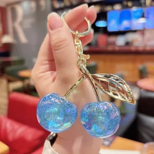 Sweet blue glitter cherry keychain, resin car bag pendant, exquisite sparkling charm for girls.