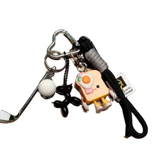 Cute toast bread keychain with woven lanyard and fun charms, perfect backpack and phone accessory.