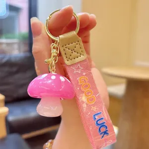 Cute pink jelly mushroom keychain with strap, glossy resin pendant for keys and bags accessory.