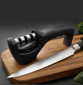 Household manual knife sharpener with multi-slot design and kitchen knife for daily use.