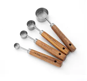 Stainless steel measuring spoons set with wooden handle kitchen baking tools cooking gadgets.