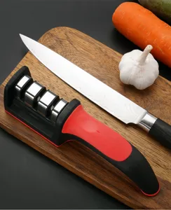 Portable kitchen knife sharpener with ergonomic handle for fast blade sharpening tool.