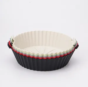 Silicone air fryer basket detail view, flexible heat resistant baking pan liner tool.
