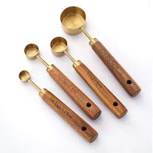 Stainless steel measuring spoons set with wooden handle and clear scale for baking and cooking.