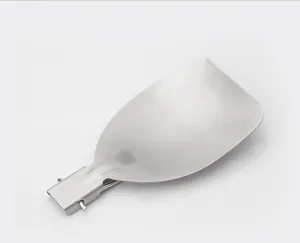 Outdoor stainless steel folding spatula detail, portable camping cookware for hiking travel.