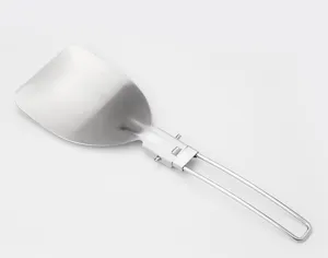 Close-up view of the portable stainless steel folding spatula showing detailed hinge mechanism.