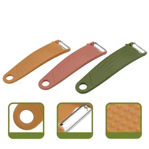 Pelador multifuncional de frutas y verduras rascador de cocina con diseño nórdico y detalles.
