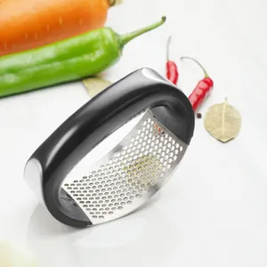 Stainless steel rocker garlic press with black handle and efficient micro-perforated base.