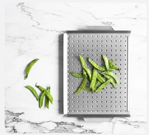 Detail view of the square non-stick grill pan with micro holes, perfect for outdoor camping BBQ.