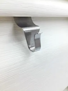 Stainless steel vinyl siding hook detail shot, punch-free wall seam hanging hardware tool.