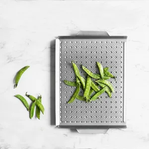 Square non-stick metal grill pan and teppanyaki plate for outdoor camping and indoor kitchen cooking.