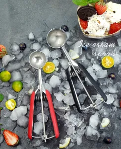 Stainless steel ice cream scoop and cookie scoop detail view, featuring durable trigger design.