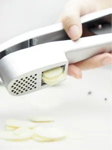 2-in-1 alloy garlic press and slicer tool for kitchen garlic mincing and slicing tasks.