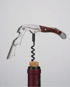 Detail shot of a stainless steel and wooden handle waiter's friend wine bottle opener.