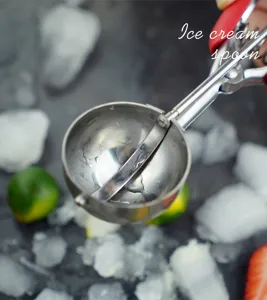 Stainless steel ice cream scoop detail showing durable mechanical trigger and deep bowl design.