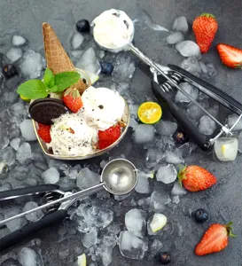 304 stainless steel ice cream scoop and cookie scoop detail shot with delicious ice cream and fruits.