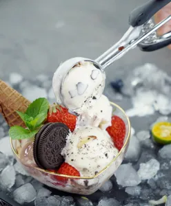 Stainless steel ice cream scoop detail view, showing durable structure for easy use.