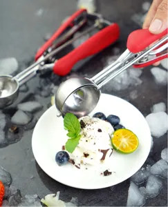 Stainless steel ice cream scoop with red handle for kitchen and cookie dough baking tool