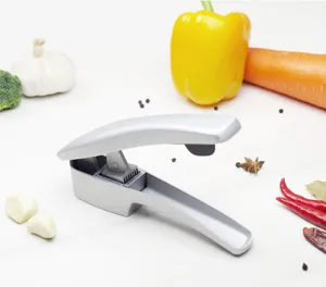 Ergonomic stainless alloy garlic press detail view showing sharp blade and pressing mechanism.