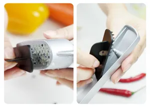 Detail view of alloy garlic press showing cleaning brush mechanism and easy food preparation.