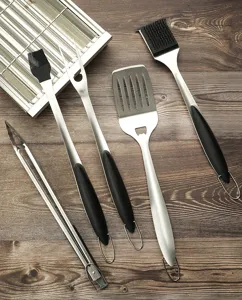 Stainless steel BBQ grill tools set, includes spatula, tongs, fork, and brushes for outdoor camping.