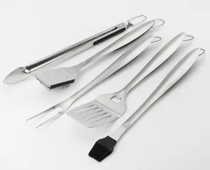 Detailed view of the stainless steel BBQ tool set, showing fork, spatula, tongs and brushes.