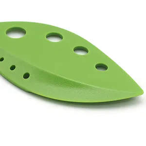 Green leaf herb stripper tool with multiple holes for fast leafy greens and kitchen use main view