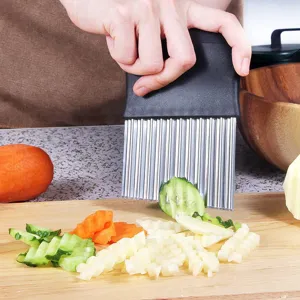Stainless steel crinkle cutter for wavy french fries, potato and vegetable slicing tool.