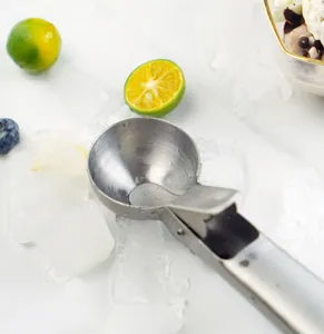 Stainless steel ice cream scoop with trigger mechanism for easy dessert preparation.