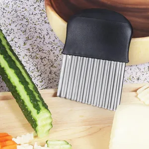 Stainless steel crinkle cutter with black handle, ideal for slicing potatoes, cucumbers and cheese.