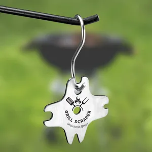 Stainless steel grill scraper with hanging hook for easy outdoor BBQ cleaning and maintenance.