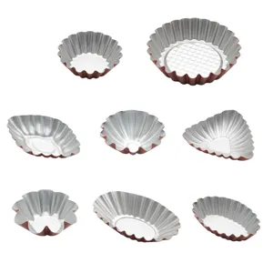 Set of metal fluted tart molds, egg tart pans, and flower cake baking cups in assorted shapes.
