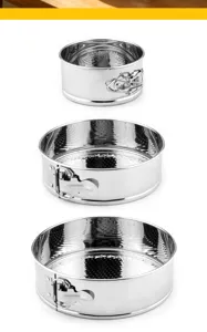Stainless steel springform cake pan detail, showing round baking mold and secure lock.