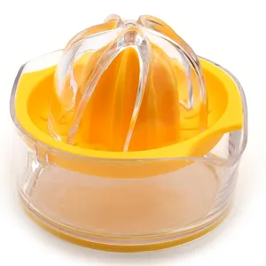 Manual plastic citrus juicer with scale cup, yellow hand lemon orange squeezer tool.
