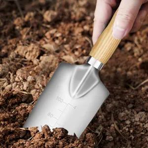 Stainless steel garden shovel with wooden handle and measuring scale for planting flowers.
