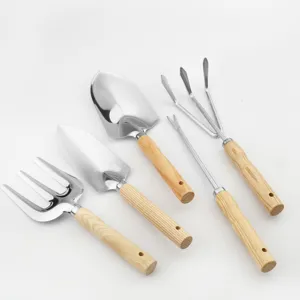 Stainless steel garden tool set 5 pieces with wooden handles and measurement scale for planting.