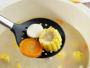 Silicone slotted spoon detail showing food straining in pot for kitchen cooking.