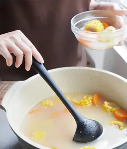 Enhance your cooking with this durable black silicone soup ladle. Perfect for non-stick pots!