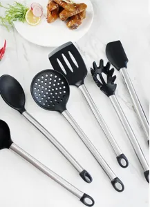 Silicone kitchen utensil set detail showing black heat-resistant spatula and steel handle.