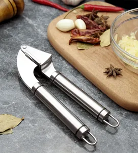 Stainless steel garlic press kitchen tool detail showing sturdy handle and press design.