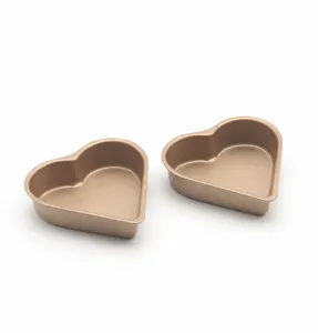 Mini heart-shaped cake pan non-stick carbon steel baking mold for delicious DIY desserts.
