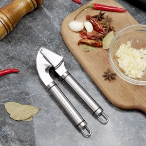 Stainless steel garlic press kitchen tool with ergonomic handles for easy mincing.