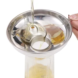 Stainless steel kitchen funnel detail showing wide mouth and detachable filter mesh for oil pouring.
