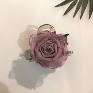 Elegant silk gauze rose flower hair claw clip for women, trendy half-up hair styling accessory.